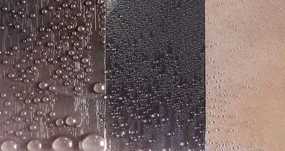 In the image, the left panel is a directional slippery rough surface (SRS, this study), the middle panel is a slippery liquid-infused porous surface (SLIPS) and the right panel is a superhydrophobic surface. This image shows a comparison of water harvesting performance of SRS vs other state-of-the-art liquid repellent surfaces.