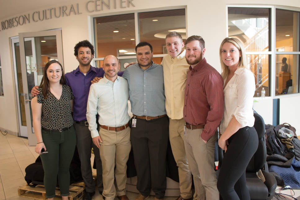 The student team poses with their prototype.