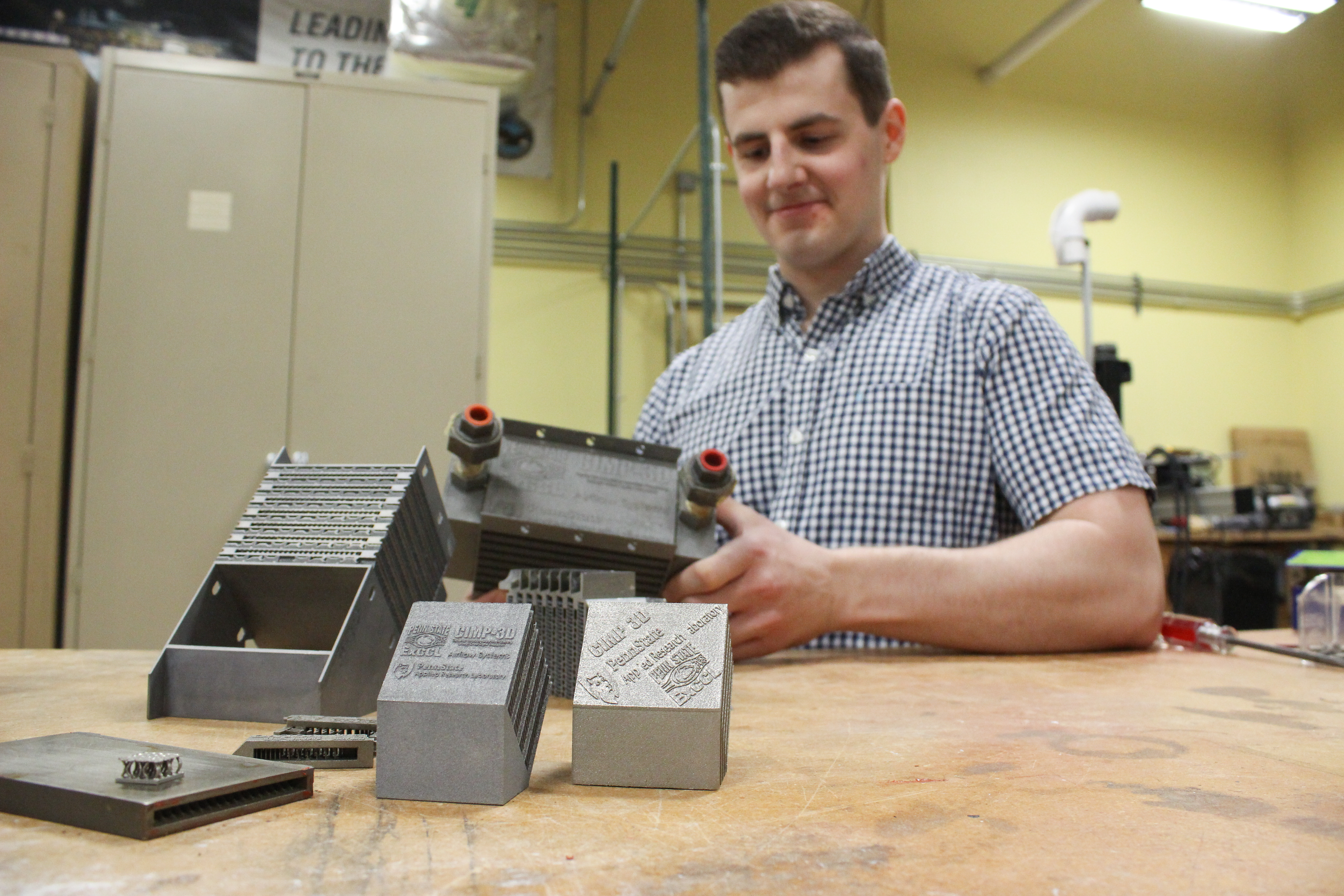 Michael Bichnevicius works with additive manufactured parts in the ExCCL Lab.