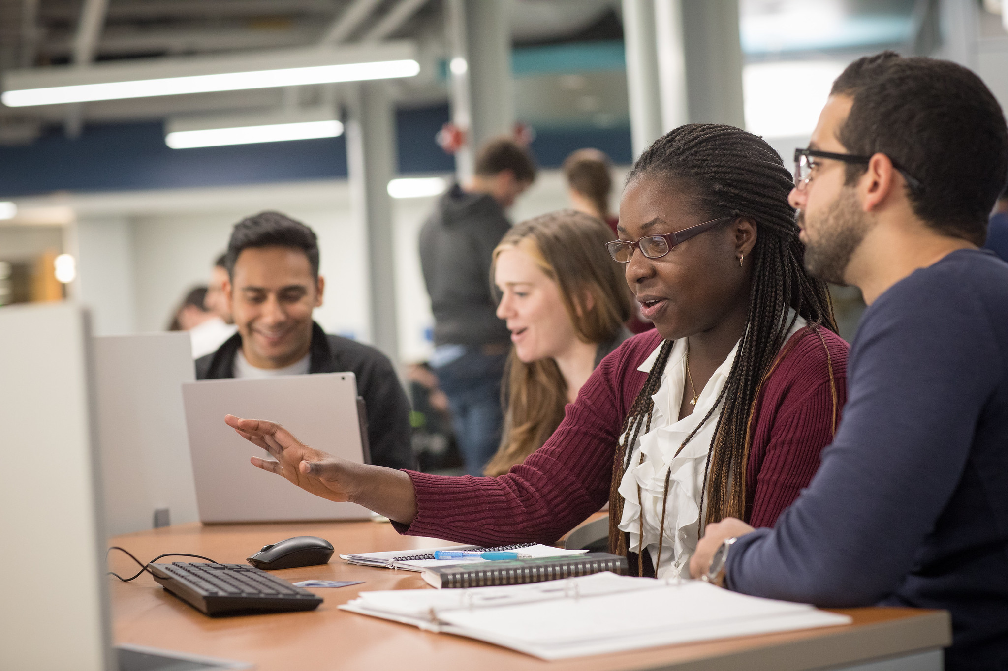 A group of undergraduate students work in the E-Knowledge Commons in the Reber building. 